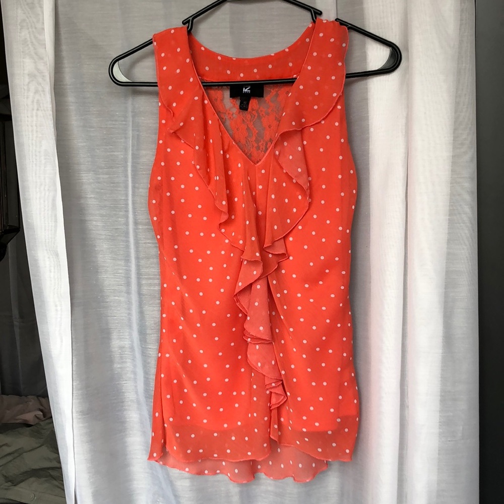 Salmon sleeveless blouse with white polka dots